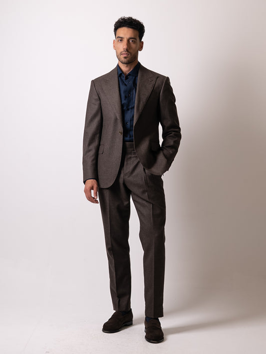 Tailored Deep brown houndstooth trousers styled with the matching blazer. Forming a cohesive suit defined by warmth, texture, and timeless British proportion. 