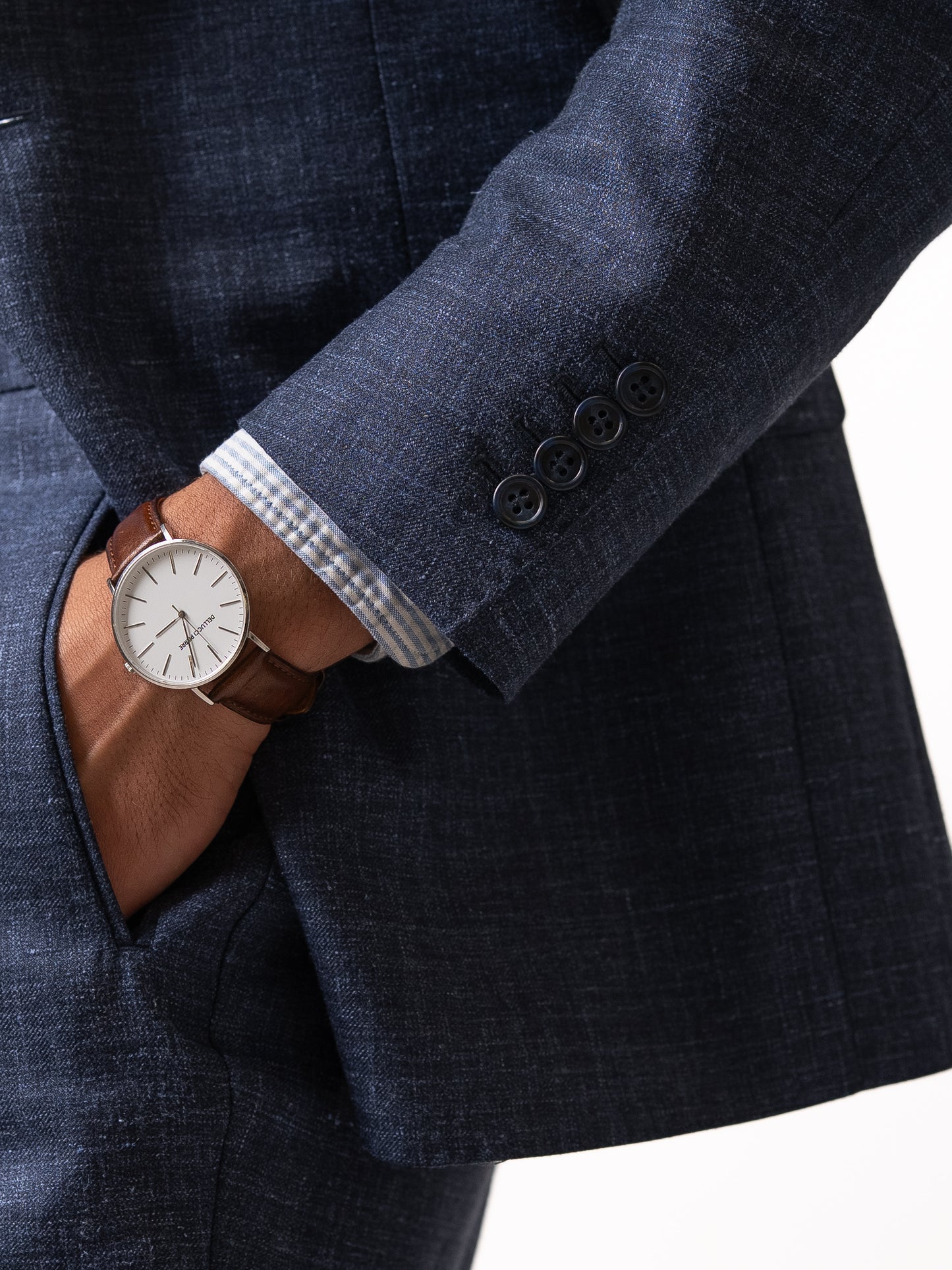 Close-up of the functional cuff on a light blue linen-wool blazer 
