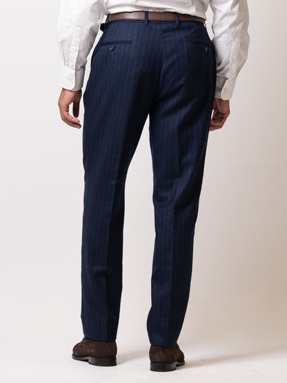 Chalk stripe Gurkha tailored trousers seen from the back double pleats.