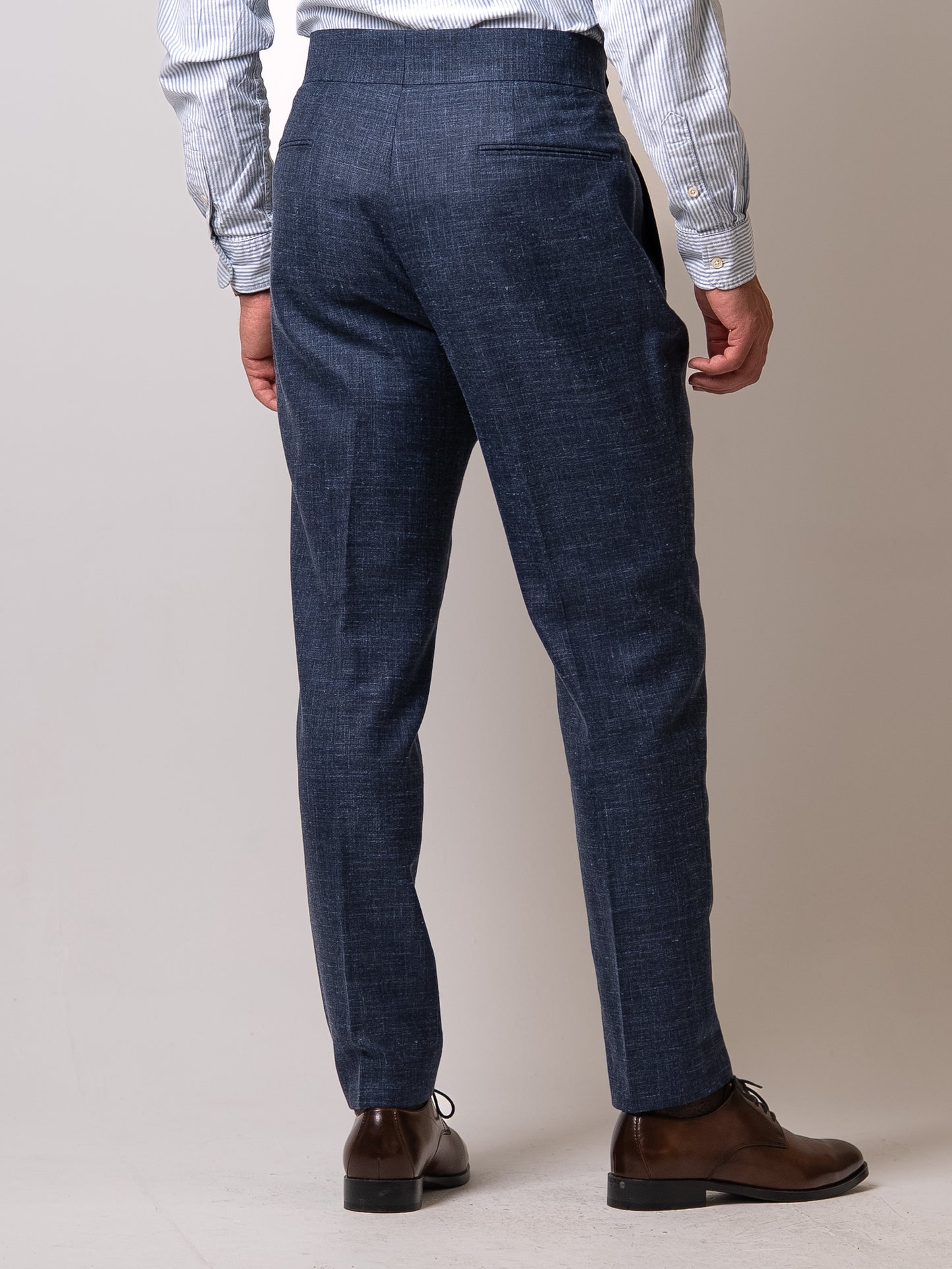 Back view of light blue linen-wool trousers